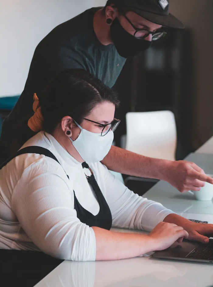 Colleagues working together on a laptop
